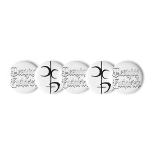 The Decaying Eucharist "Logo" Set of (5) Buttons by Mainstay Entertainment features scratch-resistant white pins: two with black gothic “Dreaming Knights” text, two with a bold mirrored “D” abstract, and one additional unique design.
