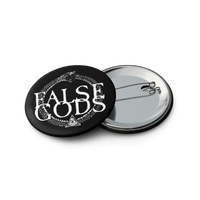 The False Gods "Snake Logo" Set of 5 Buttons by Mainstay Entertainment features glossy black pin-back buttons with "FALSE GODS" in white, a snake biting its tail, and a triangle with an eye. Design includes partially visible backs.