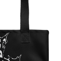 Close-up of the Flesh Parade "Meathook" Tote Bag V1 by Mainstay Entertainment in black fabric with a sturdy textured handle and part of a white abstract graphic on the left, set against a plain white background.