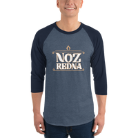 A person wearing the Mainstay Entertainment Noz Redna "Candle Logo" 3/4 Sleeve Raglan Shirt, featuring bold, stylized lettering on the front.