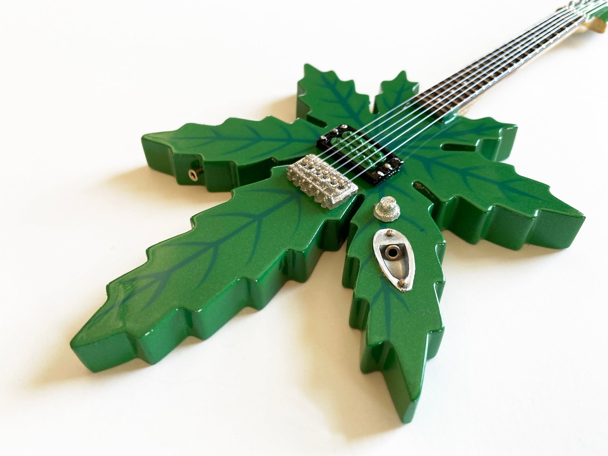 Sweet Leaf Guitars® "Mary Jane Marijuana Shape" Licensed Mini Guitar - Mainstay Entertainment