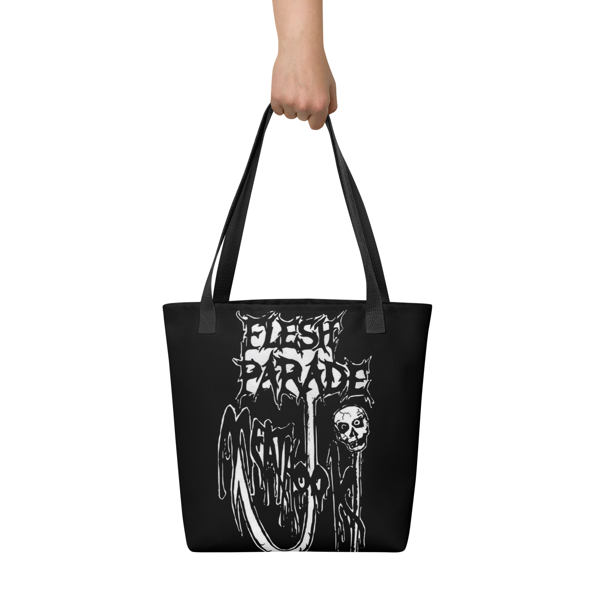A hand holds the Mainstay Entertainment Flesh Parade "Meathook" Tote Bag V1, featuring a white, horror-inspired dripping text logo above a skull and melting graphics.