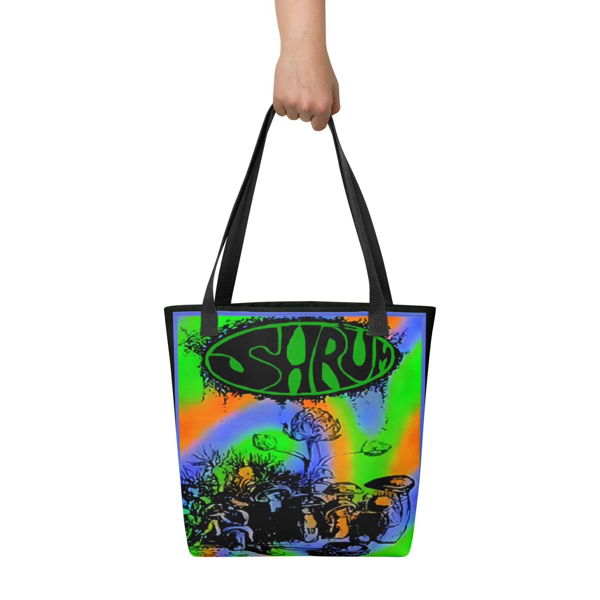 A hand holds the SHRÜM "Red Devils & Purple Ringers" Tote Bag by Mainstay Entertainment, featuring colorful neon swirls, mushrooms, and SHRUM in bold black letters inside a green oval at the top.