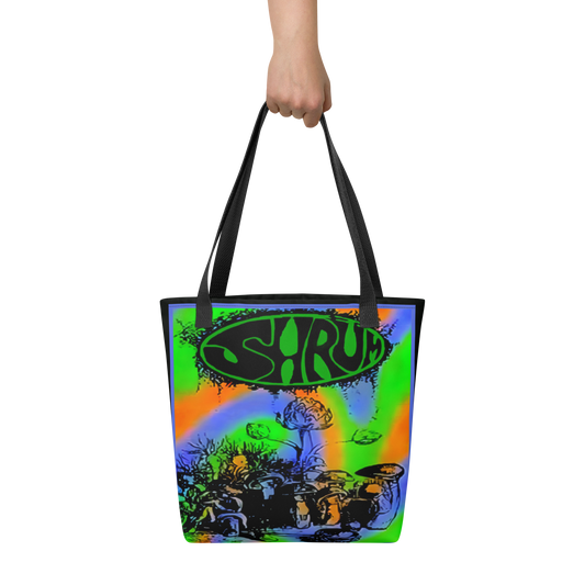 A hand holds the SHRÜM "Red Devils & Purple Ringers" Tote Bag by Mainstay Entertainment, featuring colorful neon swirls, mushrooms, and SHRUM in bold black letters inside a green oval at the top.