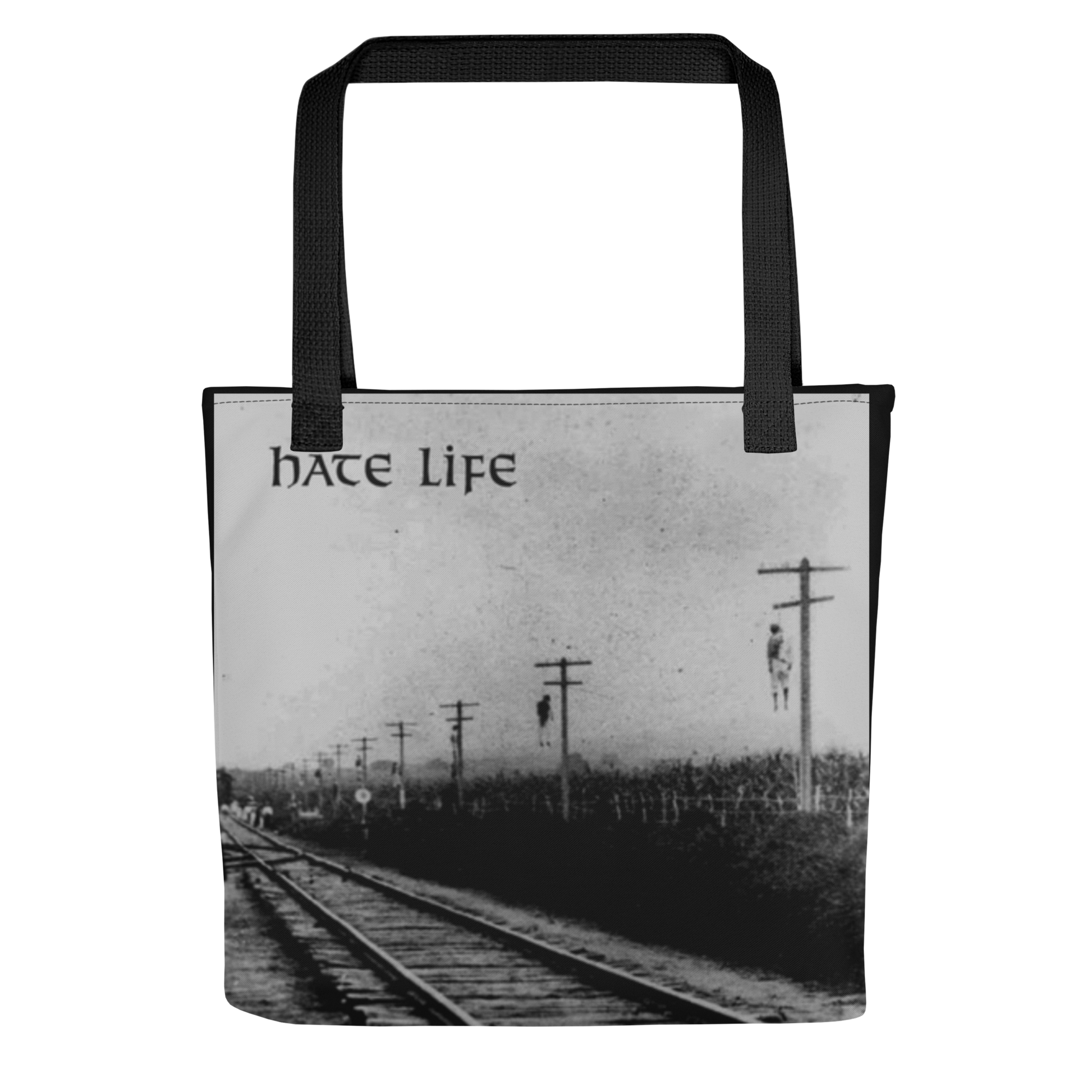 A black and white photo of train tracks with the Flesh Parade "Hate Life" Tote Bag by Mainstay Entertainment, capturing urban style in a timeless moment.