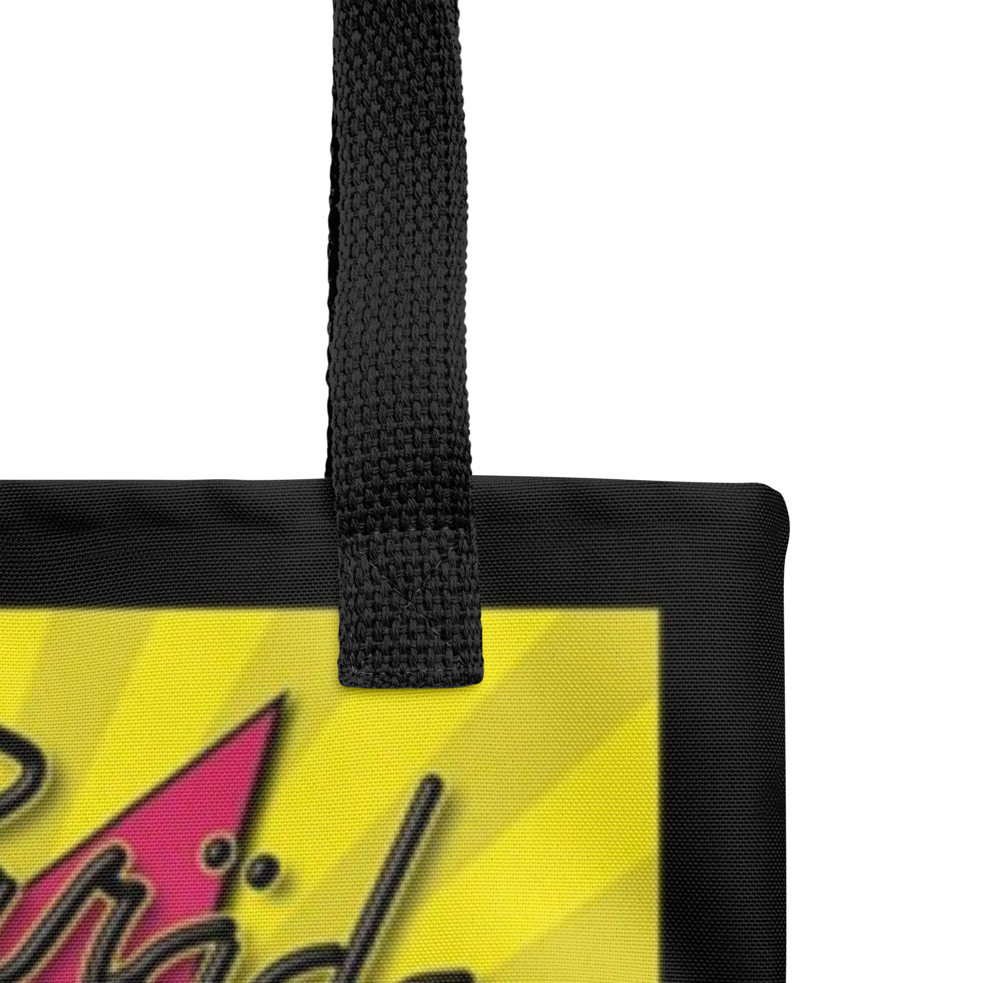 A close-up of the Flesh Parade "Dirty Sweet" Tote Bag handle by Mainstay Entertainment, showing part of a colorful design with yellow rays and bold black text on a pink shape in the bottom left corner.