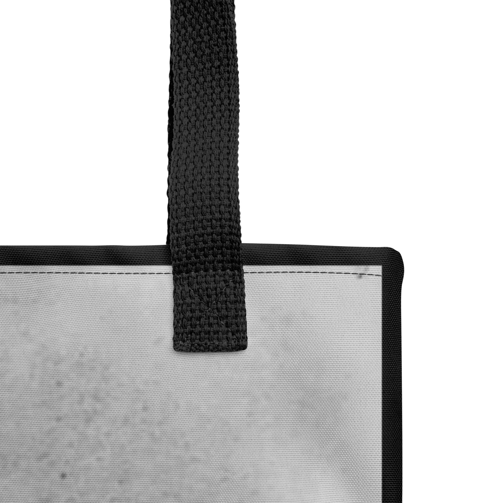 Close-up of the Flesh Parade "Hate Life" Tote Bag by Mainstay Entertainment, showing the top corner with a black strap and trim. The light gray textured fabric and stylish, spacious design are partially visible.