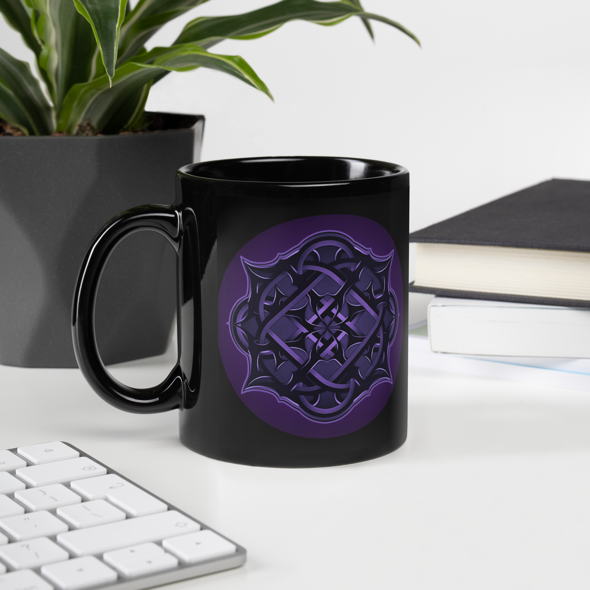 The Flesh Parade "Repercussions" Coffee Mug by Mainstay Entertainment, featuring a purple geometric design on black ceramic, sits on a white desk near a keyboard, plant, books, and papers. Microwave safe—ideal for daily use.