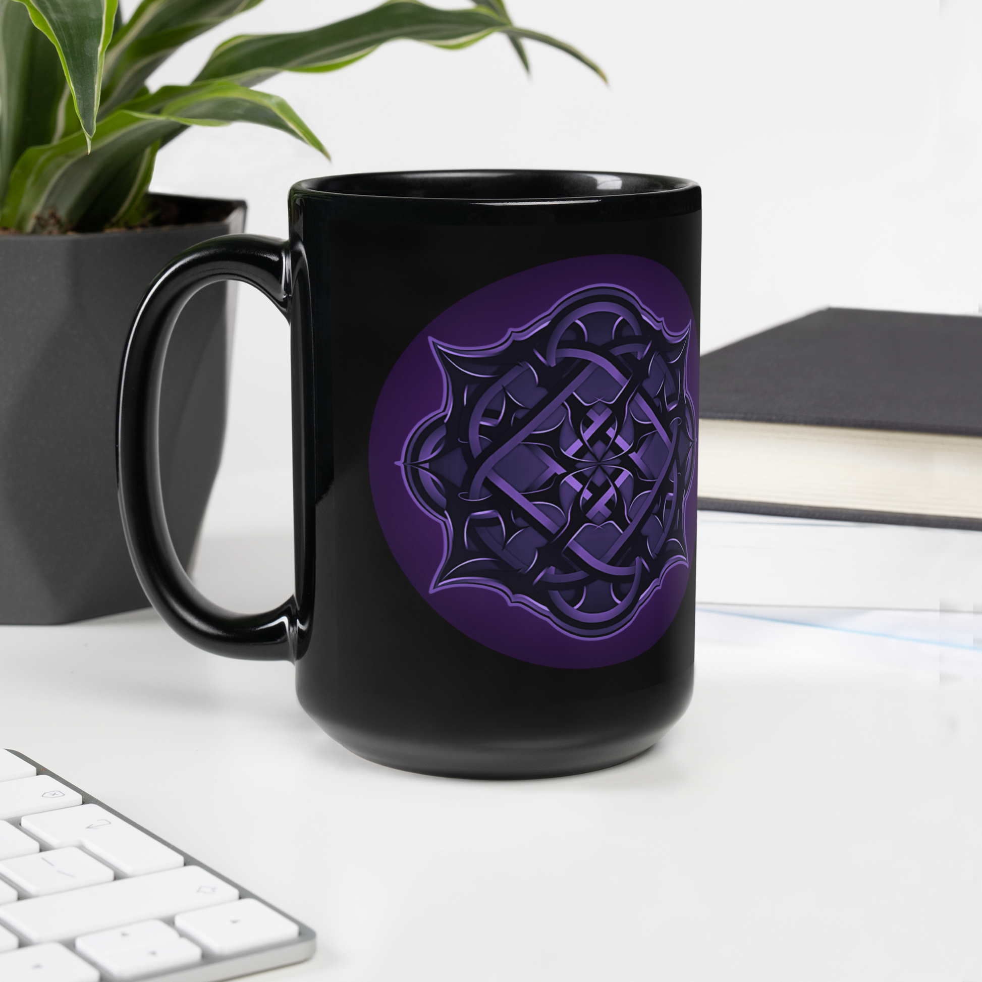 The Flesh Parade "Repercussions" Coffee Mug by Mainstay Entertainment—a black ceramic mug with a purple geometric design—rests on a white desk near a plant, book, and keyboard. It's dishwasher and microwave safe for everyday convenience.
