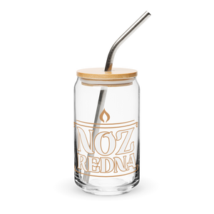 The Noz Redna "Candle Logo" Can-Shaped Glass by Mainstay Entertainment is a 16 oz glass cup with orange NOZ REDNA text, a flame symbol above, plus a bamboo lid and metal straw—all on a clean white background.
