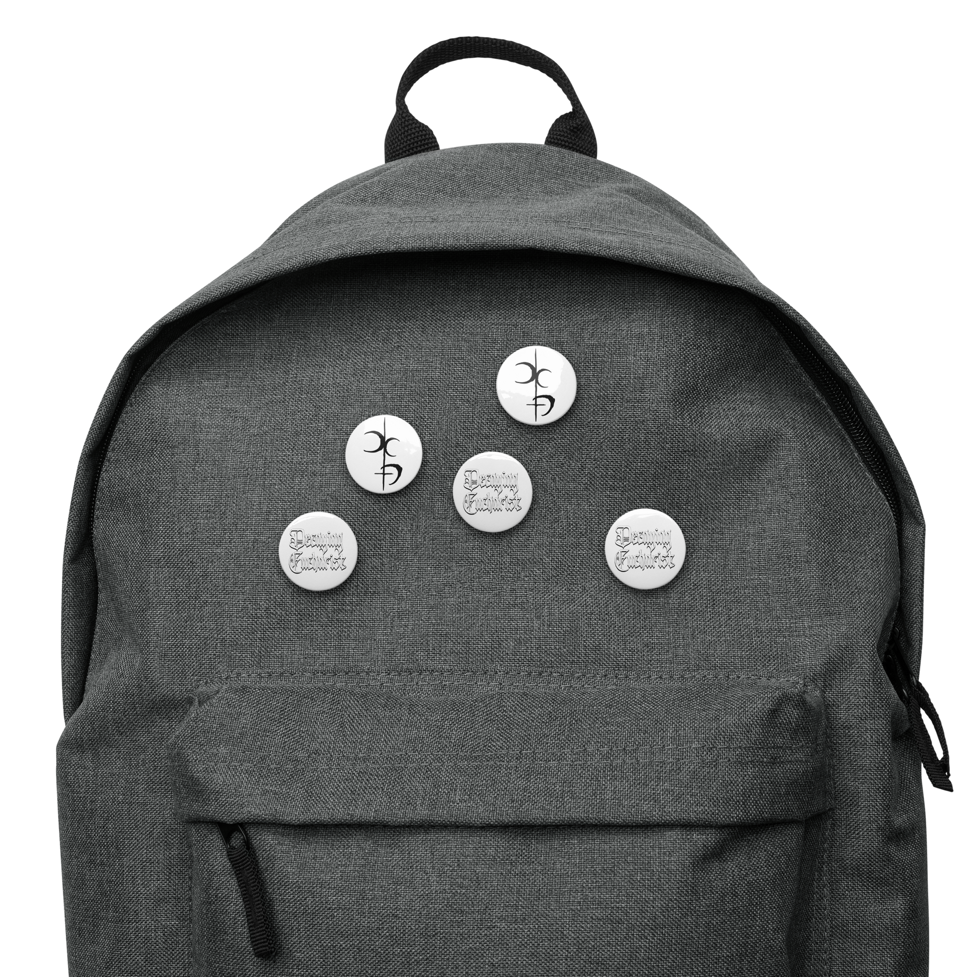 A gray backpack featuring Mainstay Entertainment's Decaying Eucharist "Logo" set: five round, scratch-resistant pins—three with a black abstract logo and two with handwritten text reading "You’re doing great sweetie.