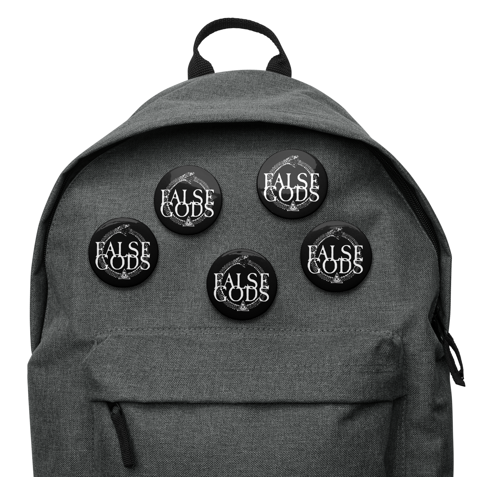 A gray backpack features five Mainstay Entertainment False Gods "Snake Logo" buttons, each with a glossy finish and bold white uppercase text, attached to the front pocket for added style.