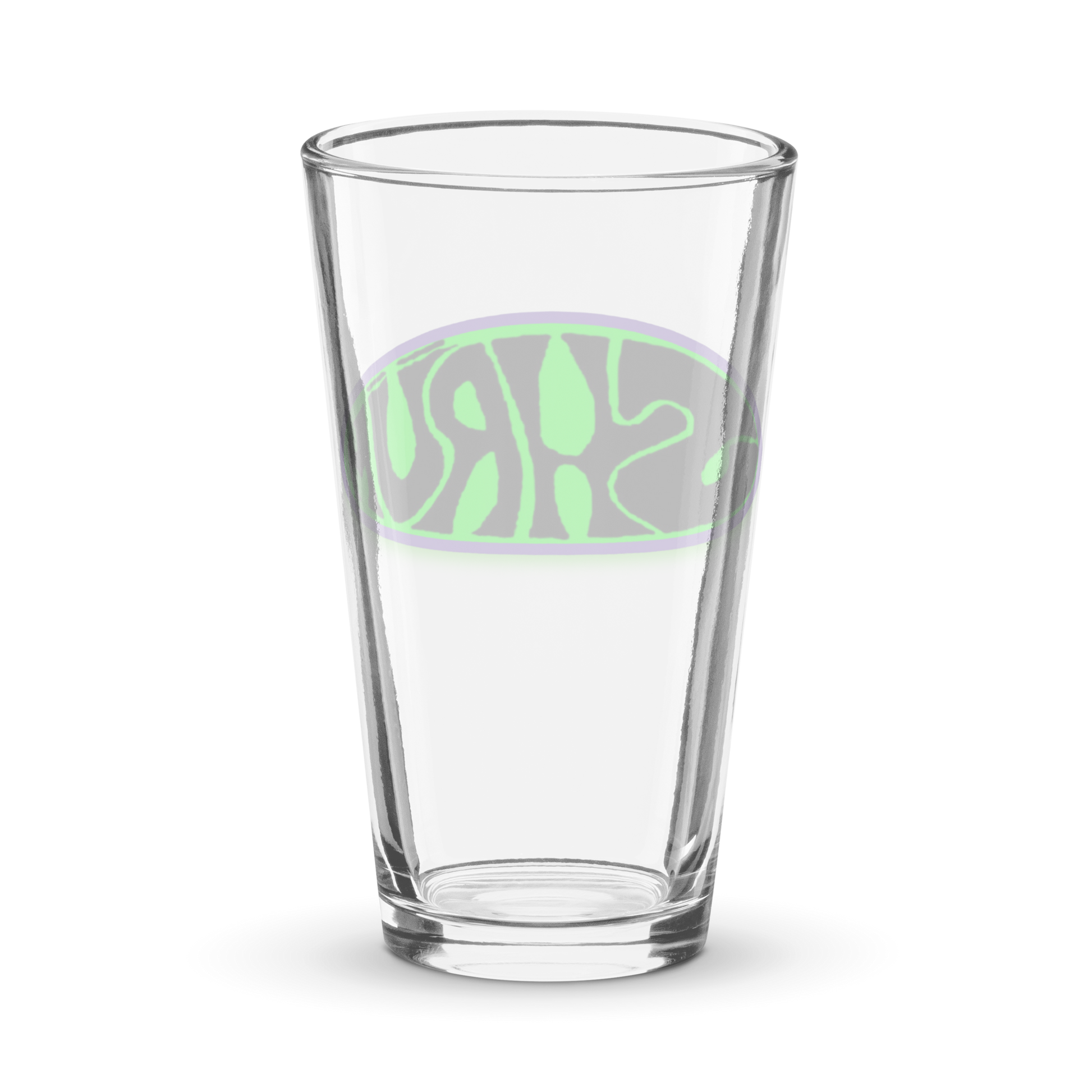 The SHRÜM "Logo" Pint Glass by Mainstay Entertainment is a clear 16 oz shaker glass with a green and purple abstract oval design and stylized text on the front, shown empty against a white background.