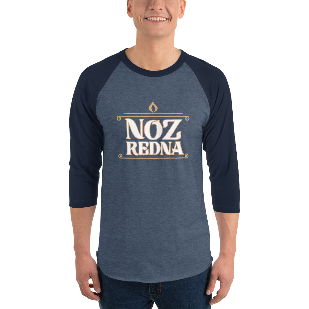 A person wearing the Mainstay Entertainment Noz Redna "Candle Logo" 3/4 Sleeve Raglan Shirt, featuring bold, stylized lettering on the front.